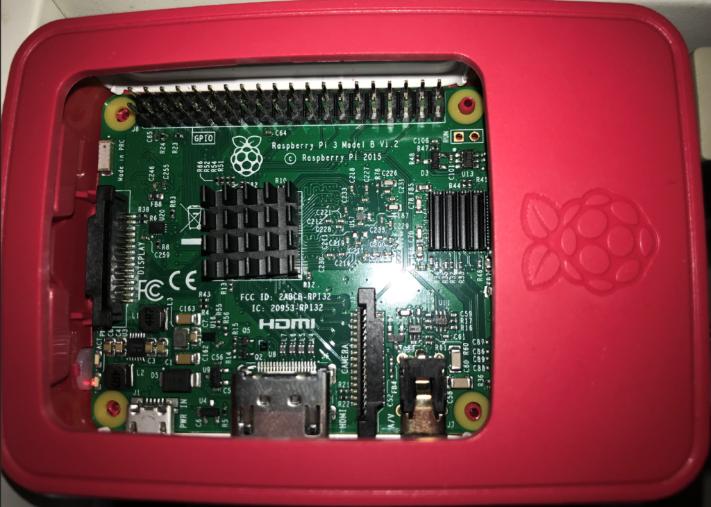 The Raspberry Pi 3 built into the case with the heat sinks glued on.